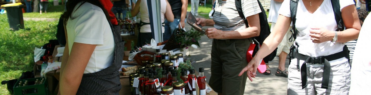 Farmer at a local market selling jams 